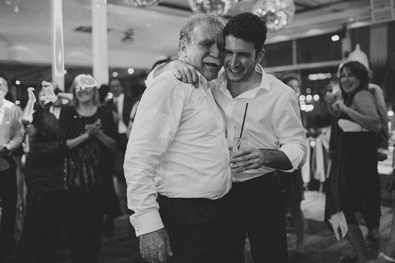 Father and son unposed wedding photography